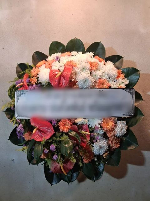 พวงหรีดหน้าวัว โทนส้มขาว